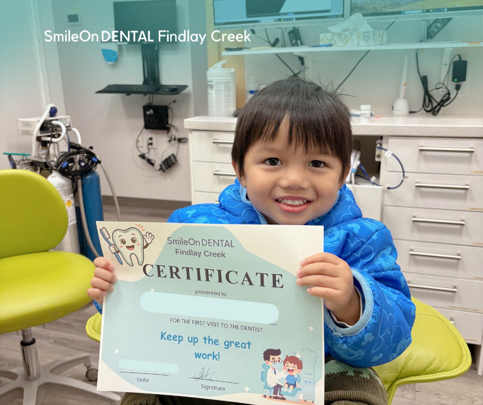 Young child smiling during a positive first dental visit at SmileOn Dental Findlay Creek